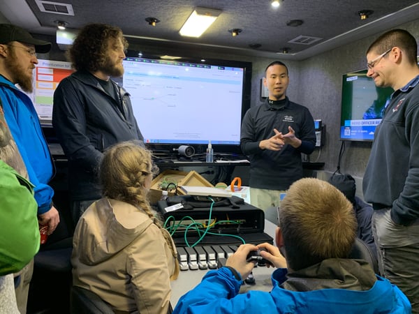 Dustin Li presents critical communications technology inside the Cisco TacOps truck.