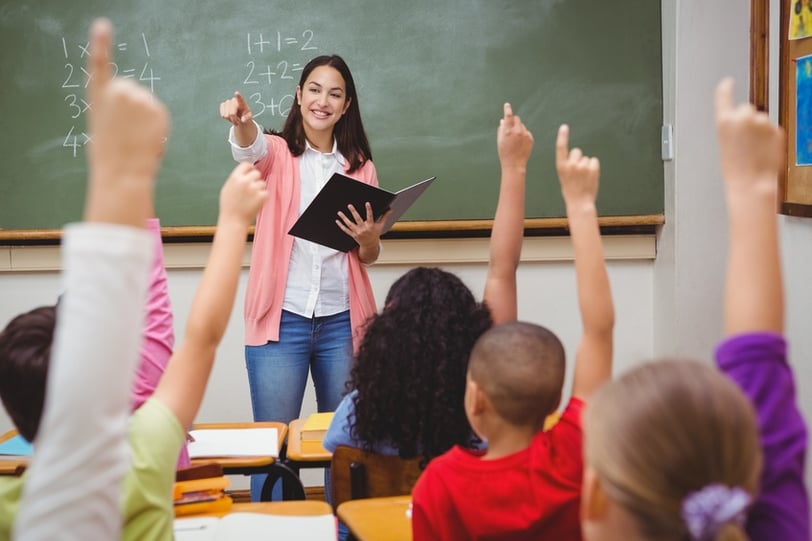 Teacher in a classroom instructing her students