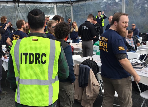 Incident Commander Larry Browne (back right) leads a disaster scenario exercise.