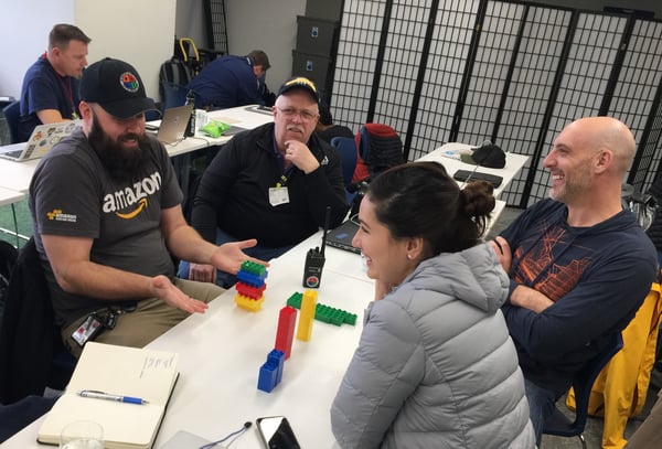 Larry and other volunteers participate in a communications exercise at the Google offices.