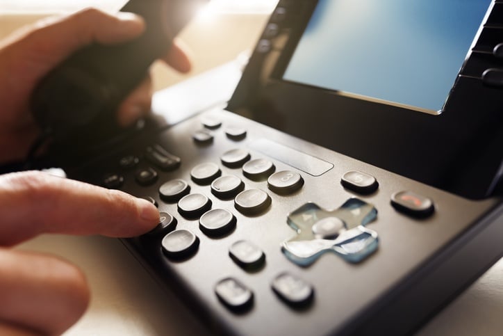 Making a call transfer on a desk phone