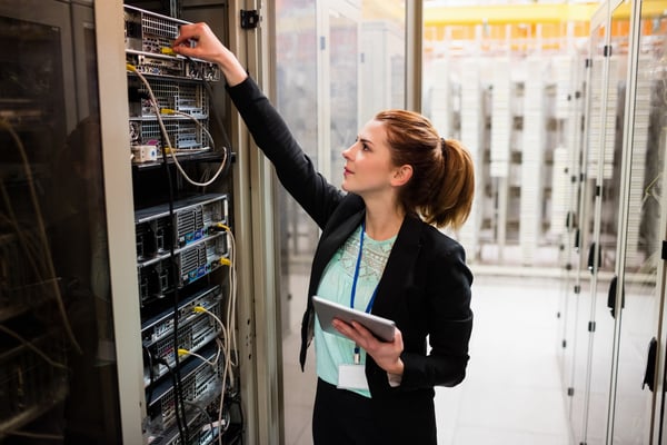 Woman working with an on-premise PBX box.