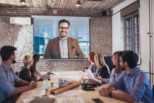 Image of business colleagues participating in a video conference call.