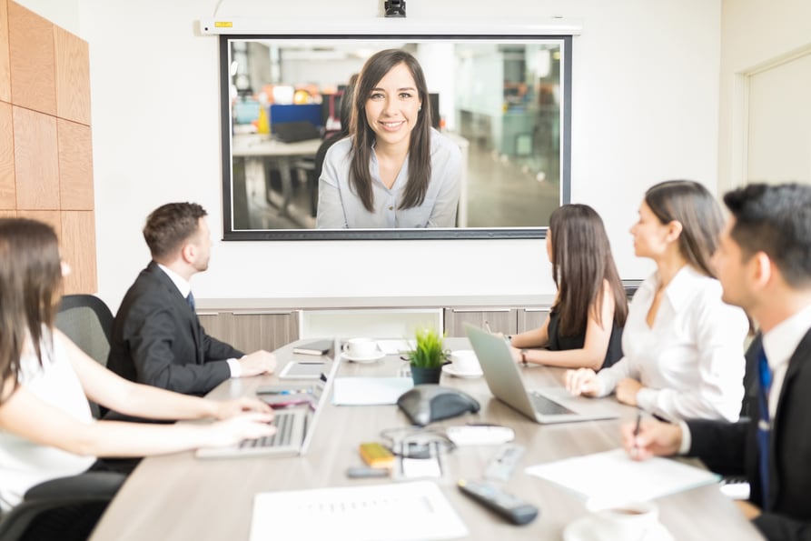 Business colleagues participating in a group video conference call.