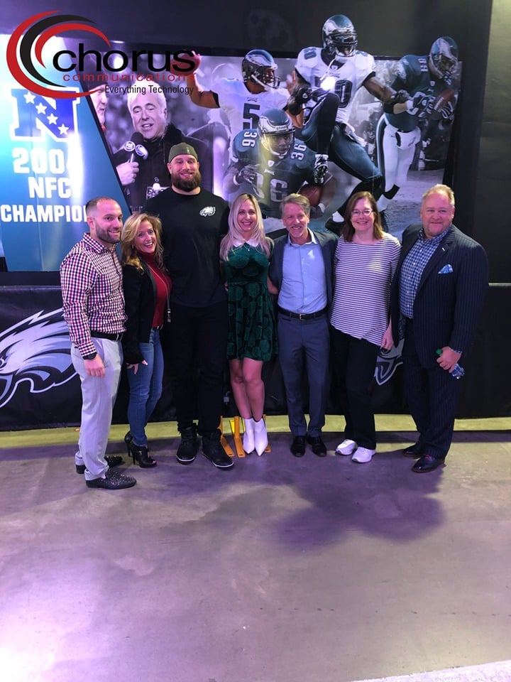 A group shot of the Chorus team with Eagles player Lane Johnson.