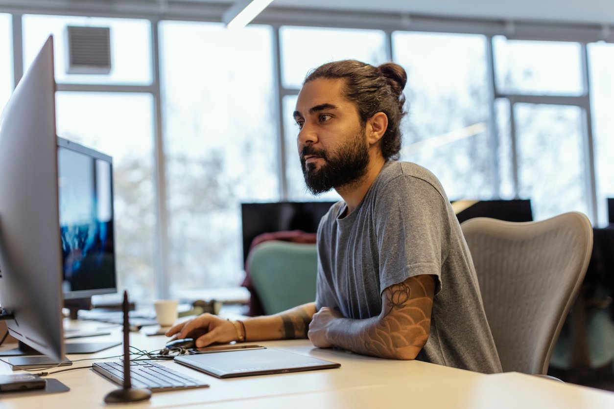 Man working on a computer in the office.