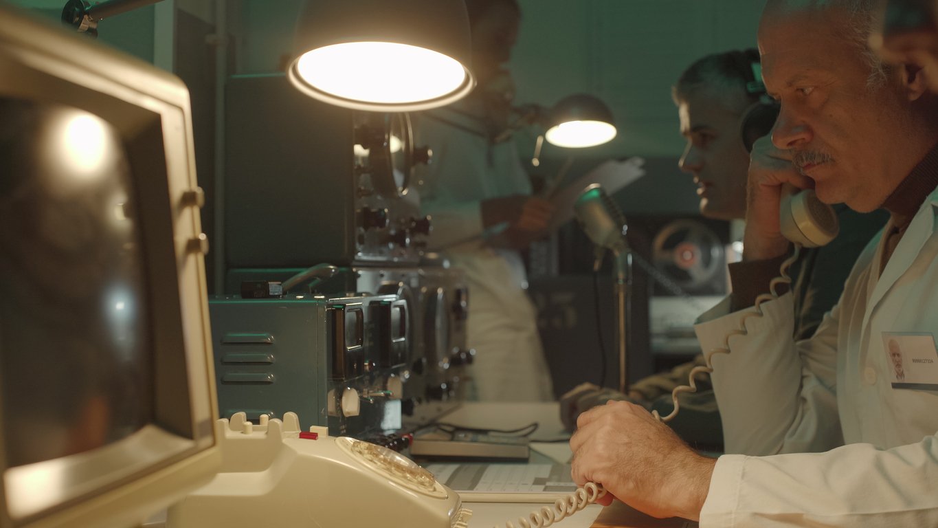 Photo of an old lab using corded landline phones.