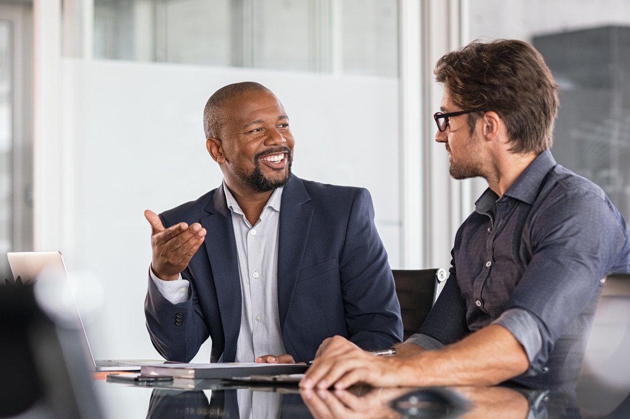 Two colleagues in a meeting.