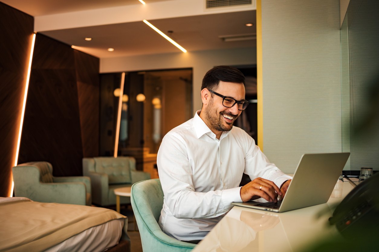 Business traveler participating in a remote meeting.