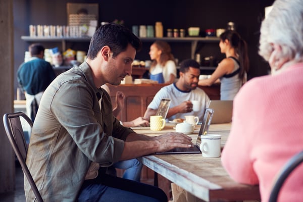 People using a cafe's free WiFi.