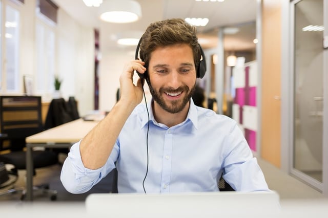 Man recording voicemail greeting