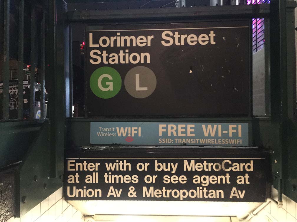 NYC subway sign promoting free WiFi.