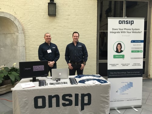 Chuck Dunne (left) and Mike Curtin (right) behind the OnSIP Technology Display booth.