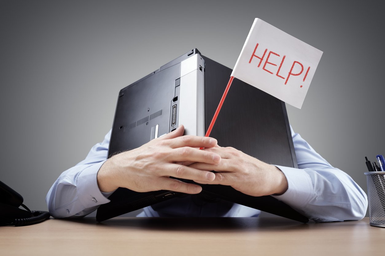 Frustrated customer who can't get in touch with customer support, waving a help flag with his laptop sitting on his head.