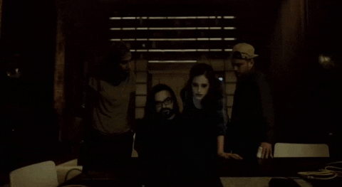 Gif from TV show Mr. Robot showing a team of hackers over a laptop.